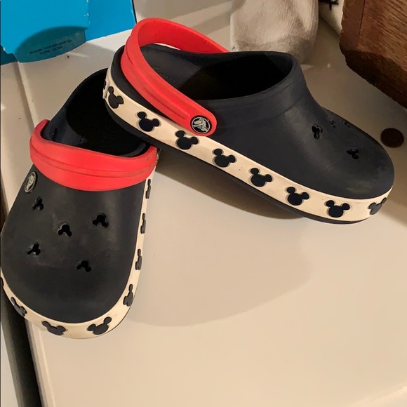 white crocs with mickey mouse holes